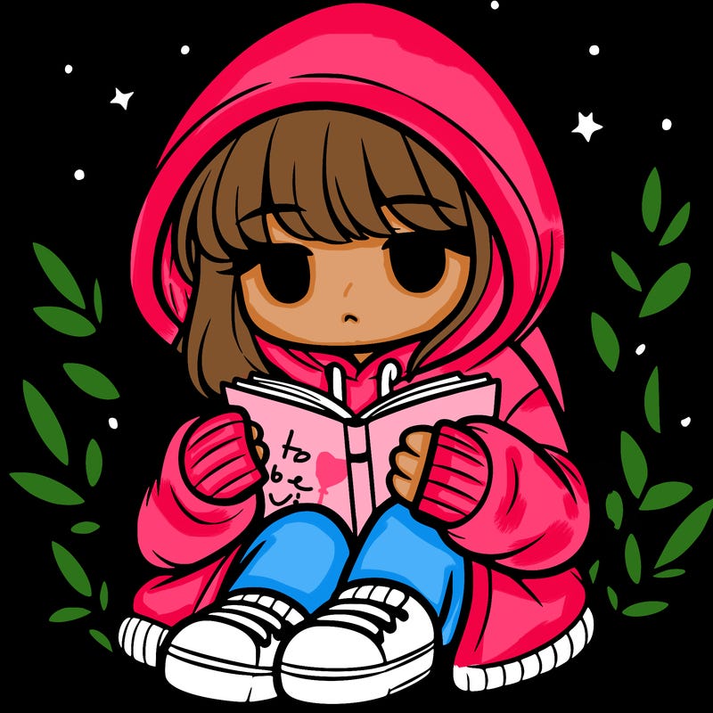 girl in oversized hoodie reading a book