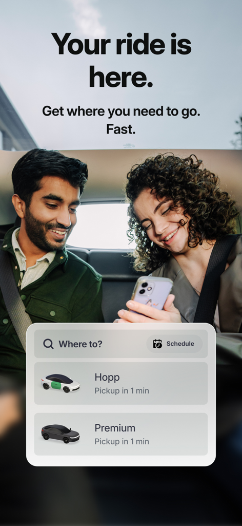 Hopp: Get a Ride - Two passengers smiling in the back of a car while using the Hopp app to request a ride