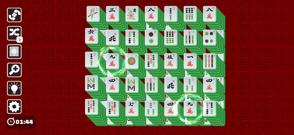 Mahjong Joy - Solitaire Tiles - A Mahjong Solitaire game board with traditional green and white tiles being matched