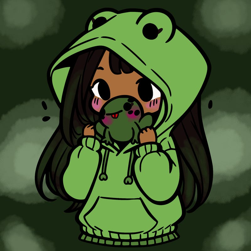 a girl holding a froggy hoodie