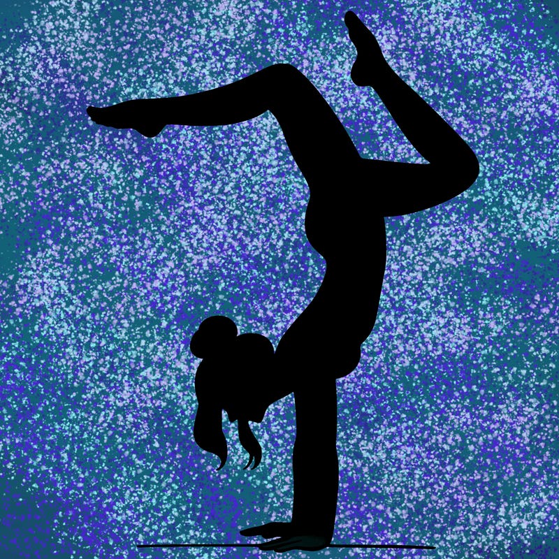 a woman doing a handstand