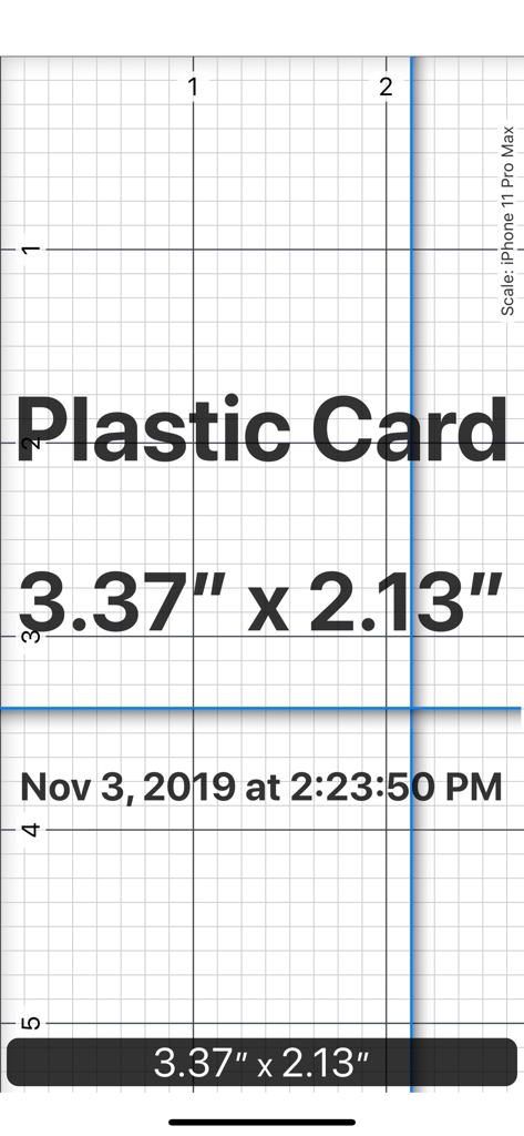 A digital ruler app interface measuring a plastic card in inches with precision grid lines and blue alignment markers.