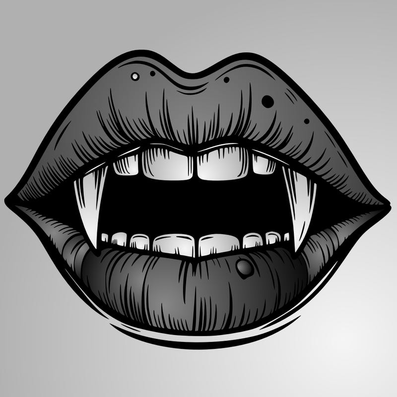lips with vampire teeth