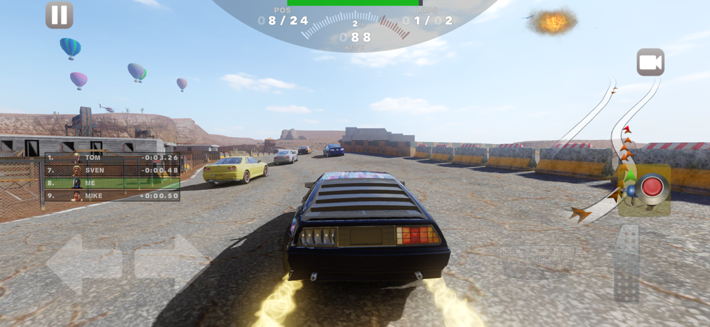 A black sports car racing on a desert track with hot air balloons in the background during a Derby Madness event.