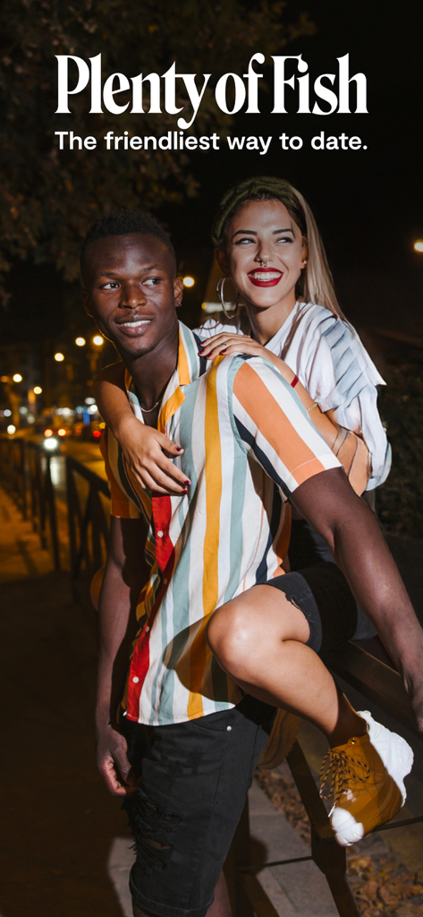 A happy diverse couple smiling together on the Plenty of Fish dating app screen.