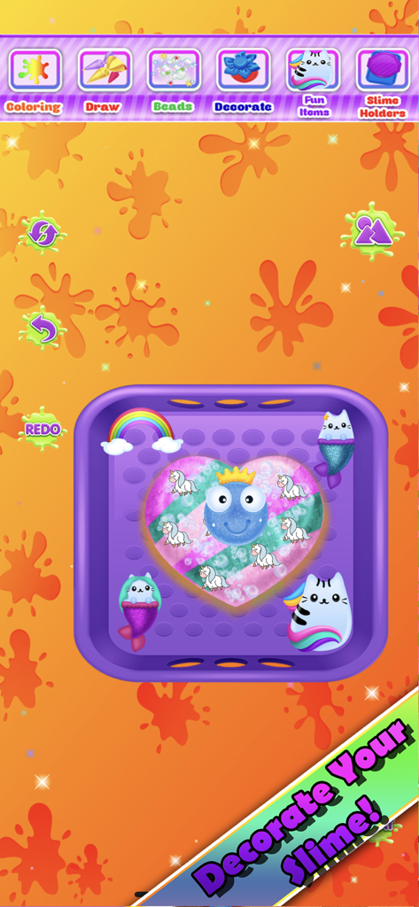 A heart shaped slime decorated with rainbows and unicorns in a purple tray