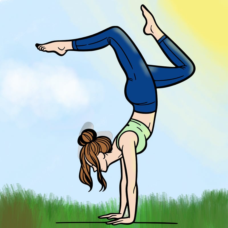 a woman doing a handstand