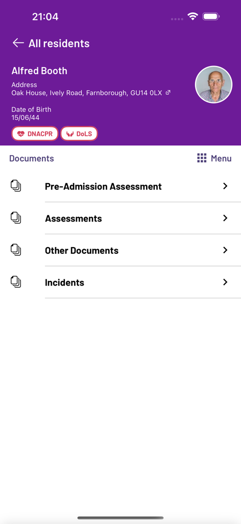 Interface of the PASSforcare app displaying a resident profile for Alfred Booth with clinical tags and document categories like assessments and incidents