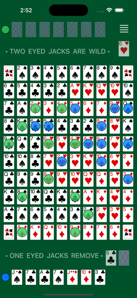 Digital Sequence board game gameplay featuring playing cards and colored chips on a green table.