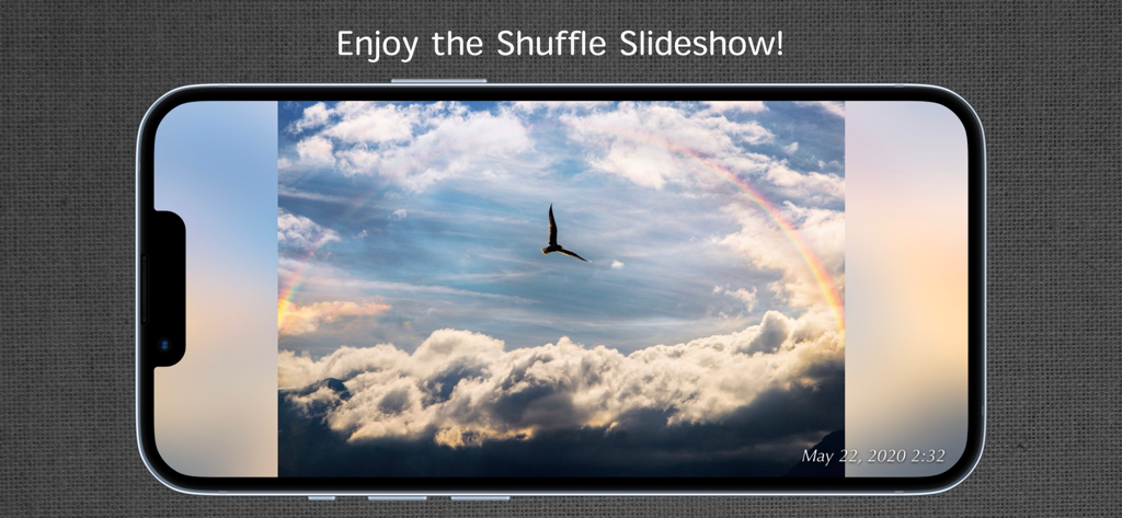 iPhone showing a landscape photo slideshow with a bird and rainbow image