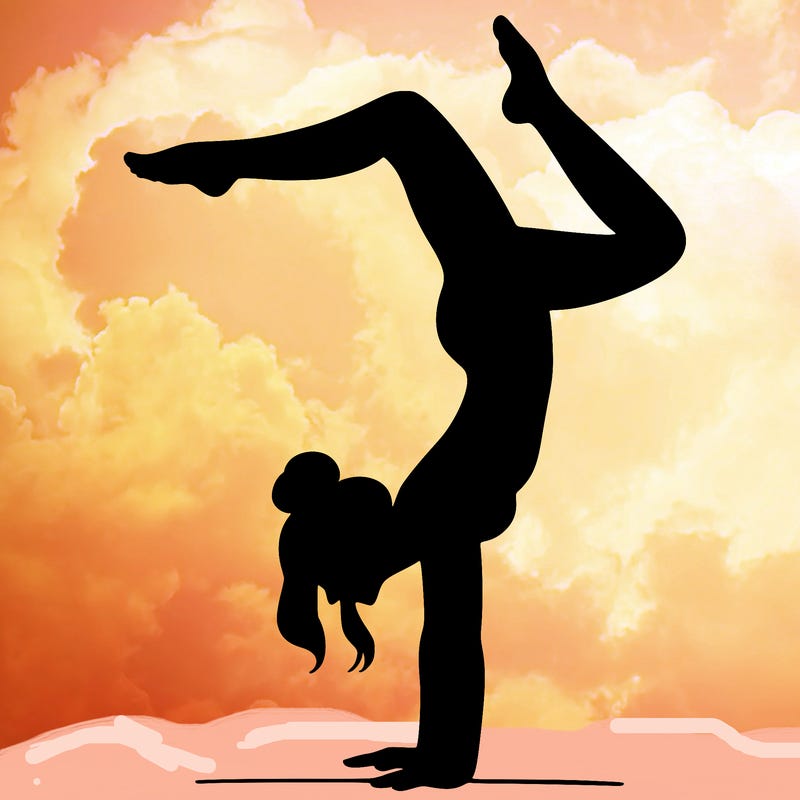 a woman doing a handstand