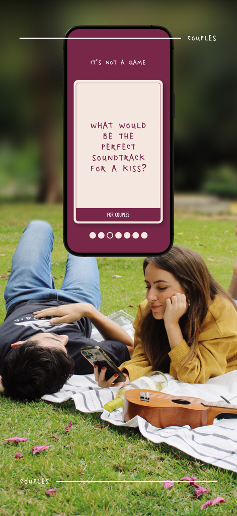It's Not a Game - Un couple lors d'un pique-nique utilisant l'application Its Not a Game pour susciter une conversation profonde.