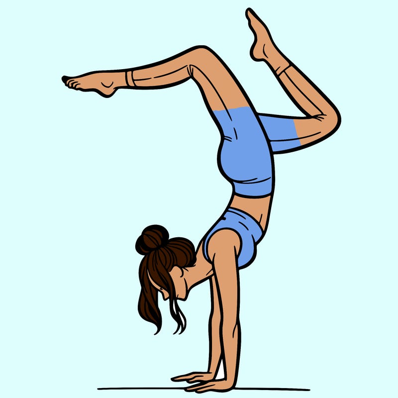 a woman doing a handstand