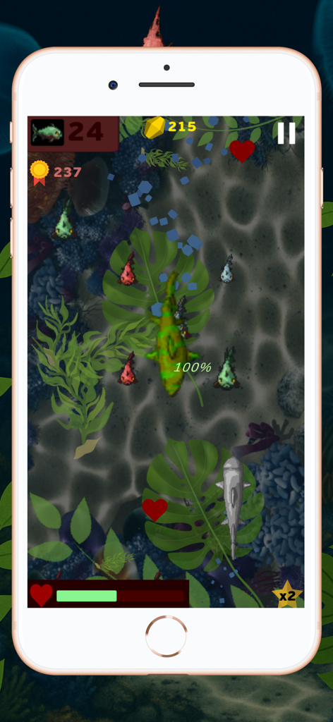 A top-down gameplay view of the Shark World arcade game showing a shark swimming among sea plants and smaller fish.
