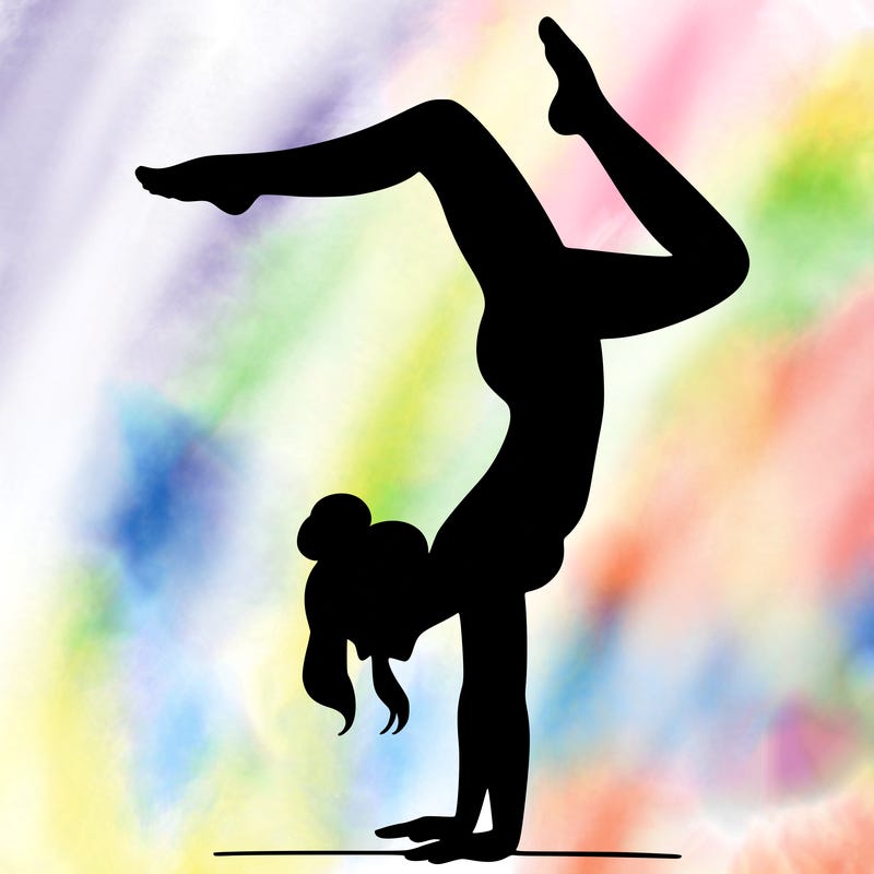 a woman doing a handstand