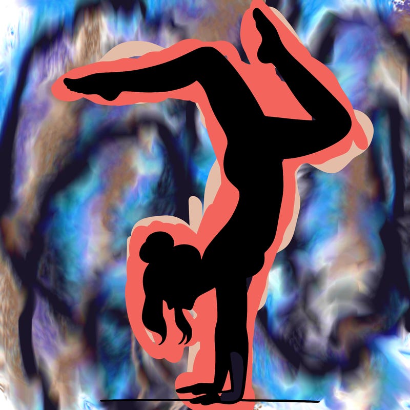 a woman doing a handstand