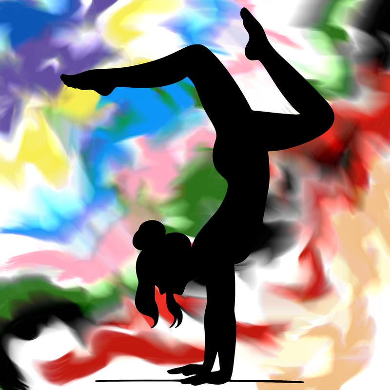 a woman doing a handstand