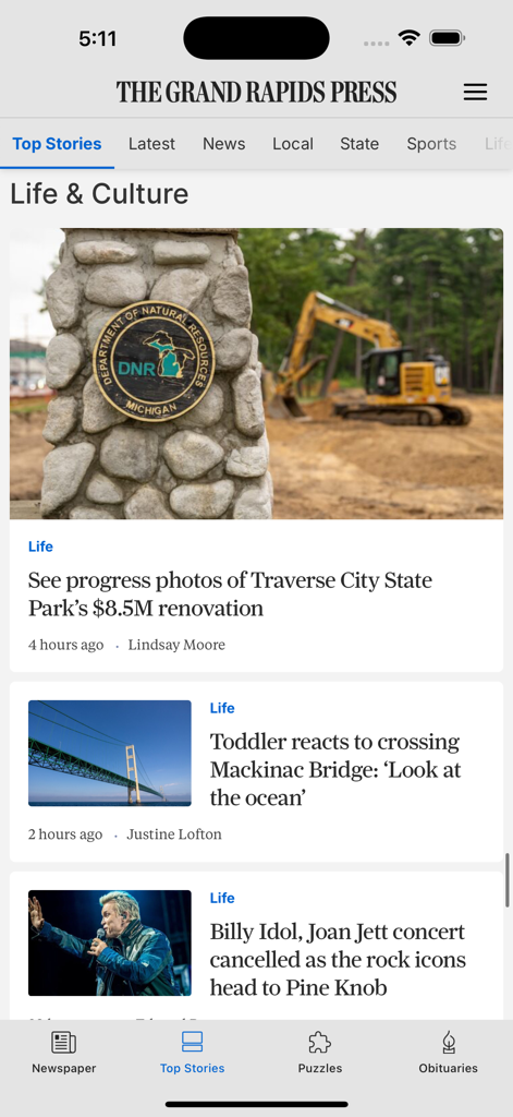 Grand Rapids Press - The Grand Rapids Press mobile app interface displaying local Michigan news articles in the Life and Culture section.