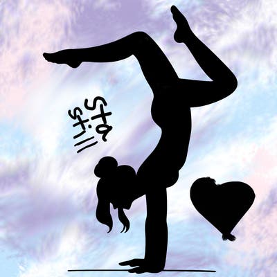 a woman doing a handstand