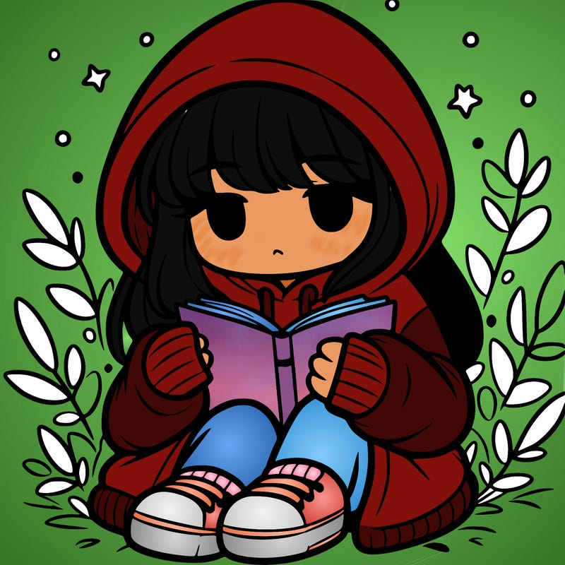 girl in oversized hoodie reading a book