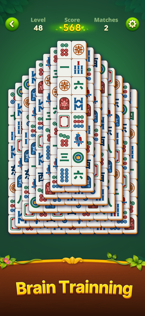 A classic mahjong solitaire game board from Mahjong Wonders featuring a brain training label