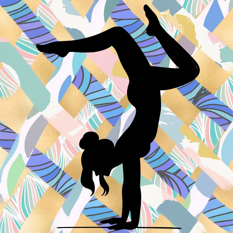 a woman doing a handstand