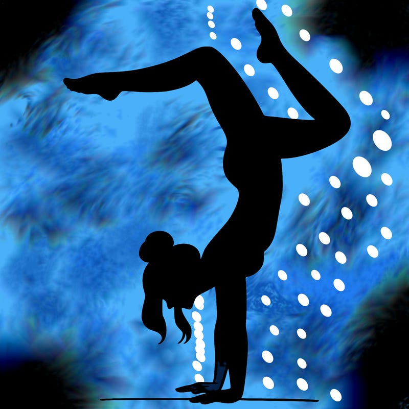 a woman doing a handstand