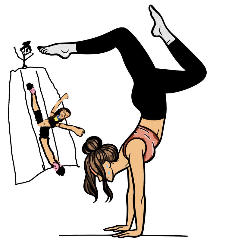 a woman doing a handstand