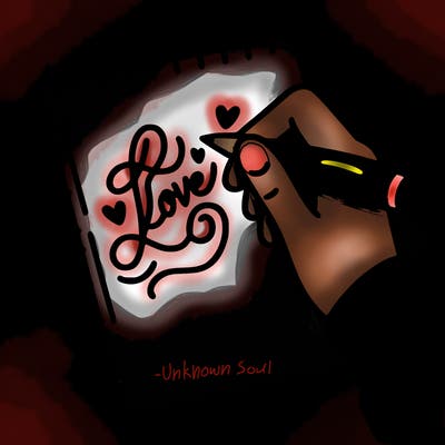 a hand writing “love” in calligraphy on a notebook