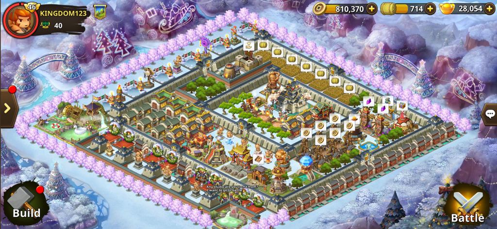 Top-down view of a customized walled city base with winter decorations and resource icons in Kingdom Story Brave Legion.