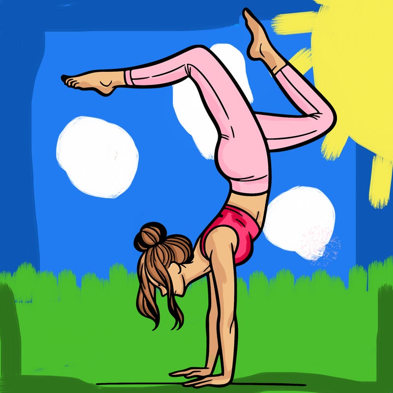 a woman doing a handstand