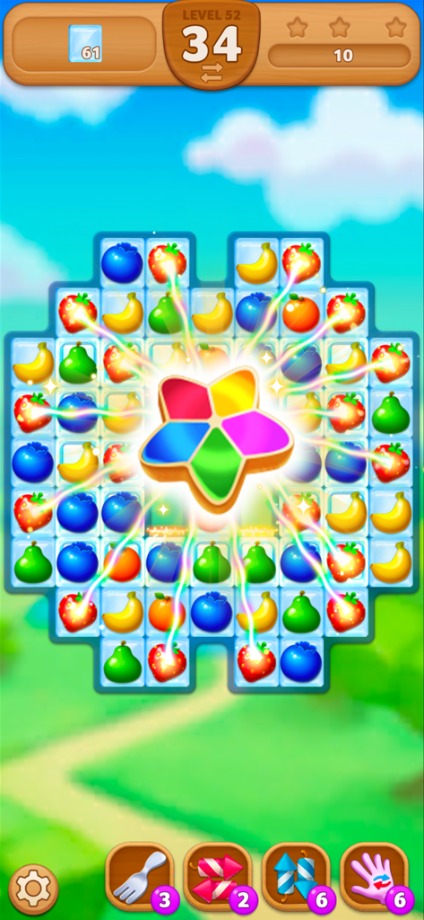 Fruits Mania : Elly’s travel - Colorful gameplay screen of Fruits Mania showing a rainbow star booster clearing fruit on a match 3 puzzle grid.