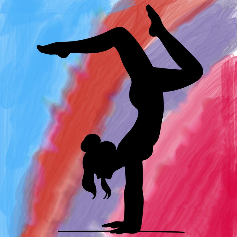 a woman doing a handstand