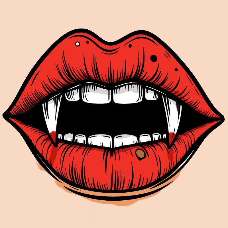 lips with vampire teeth