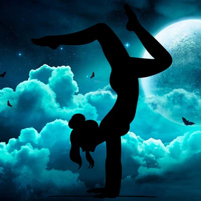 a woman doing a handstand