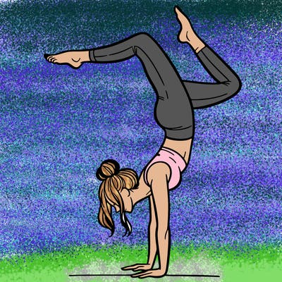 a woman doing a handstand