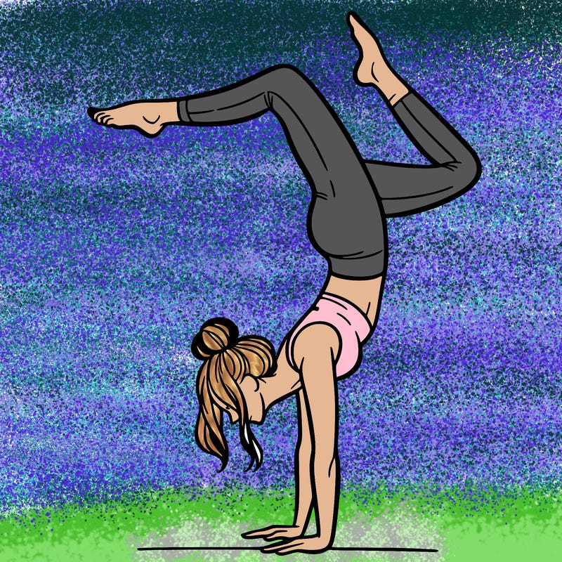 a woman doing a handstand