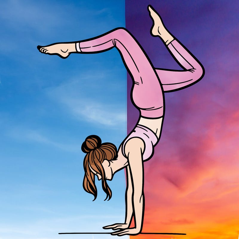 a woman doing a handstand