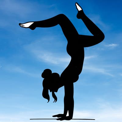 a woman doing a handstand
