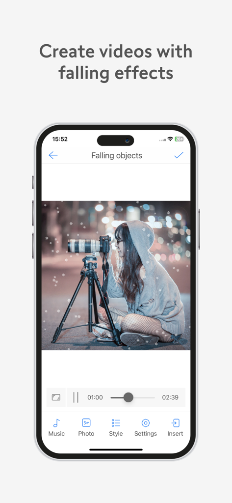 VivuVideoアプリのインターフェース。カメラを持った人物の写真の上に雪が降るエフェクトを示しています。