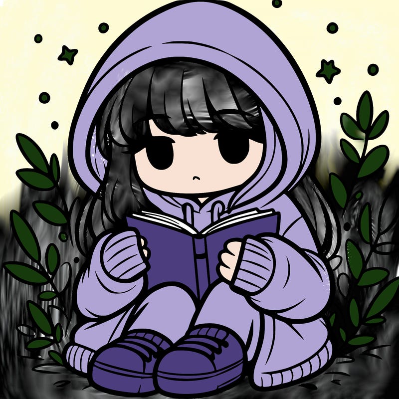 girl in oversized hoodie reading a book