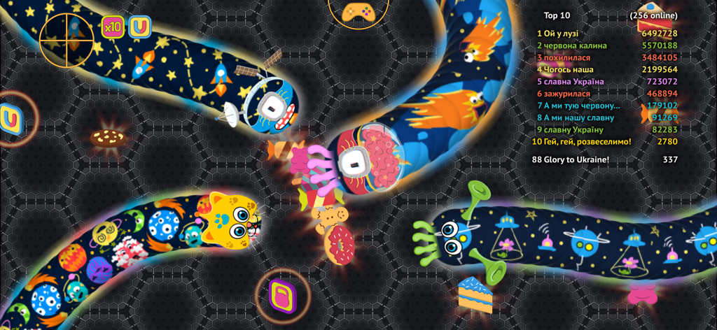 Colorful snakes eating donuts and cakes in the wormate.io multiplayer game with a top 10 leaderboard.