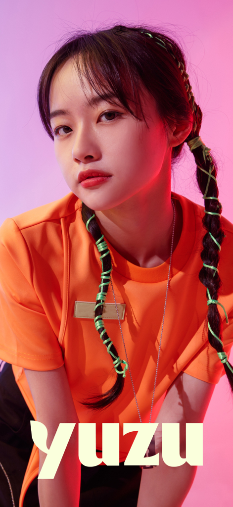 A young Asian woman with braided hair posing for the Yuzu dating and friends app