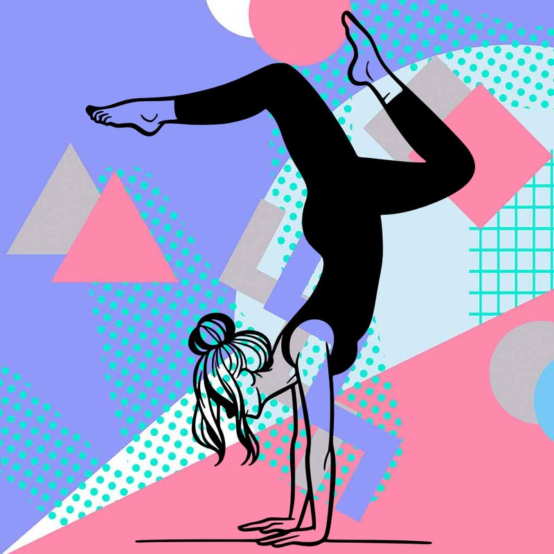 a woman doing a handstand