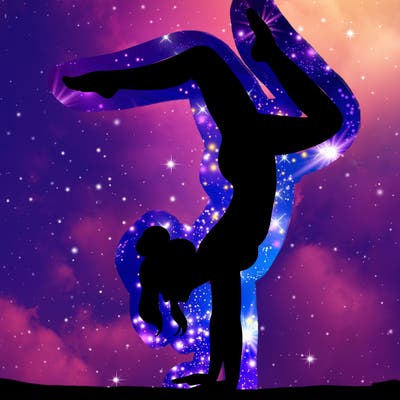 a woman doing a handstand