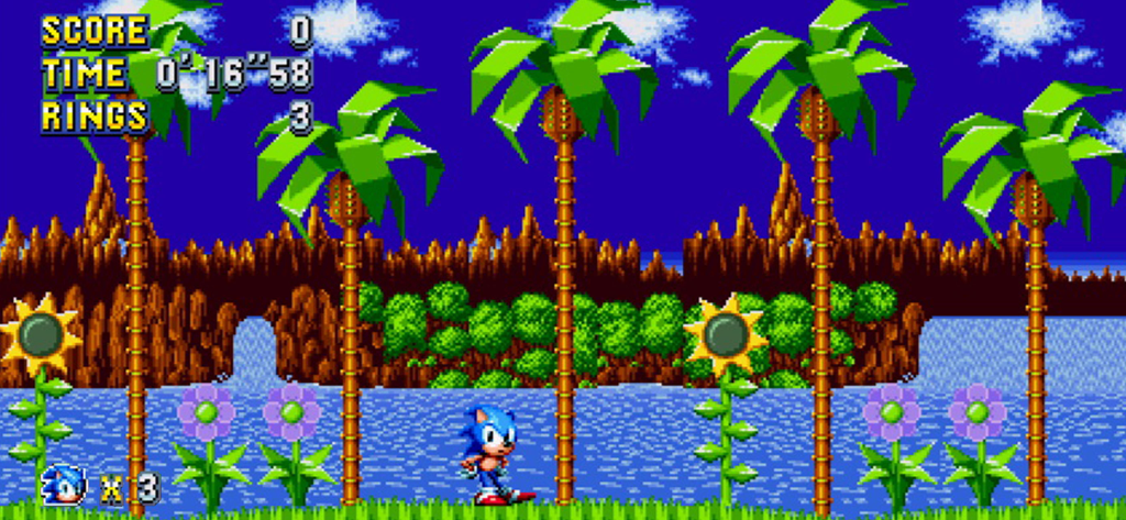 Sonic Mania Plus - NETFLIX - Sonic the Hedgehog in piedi in un vibrante livello retrò a 16 bit con palme e girasoli