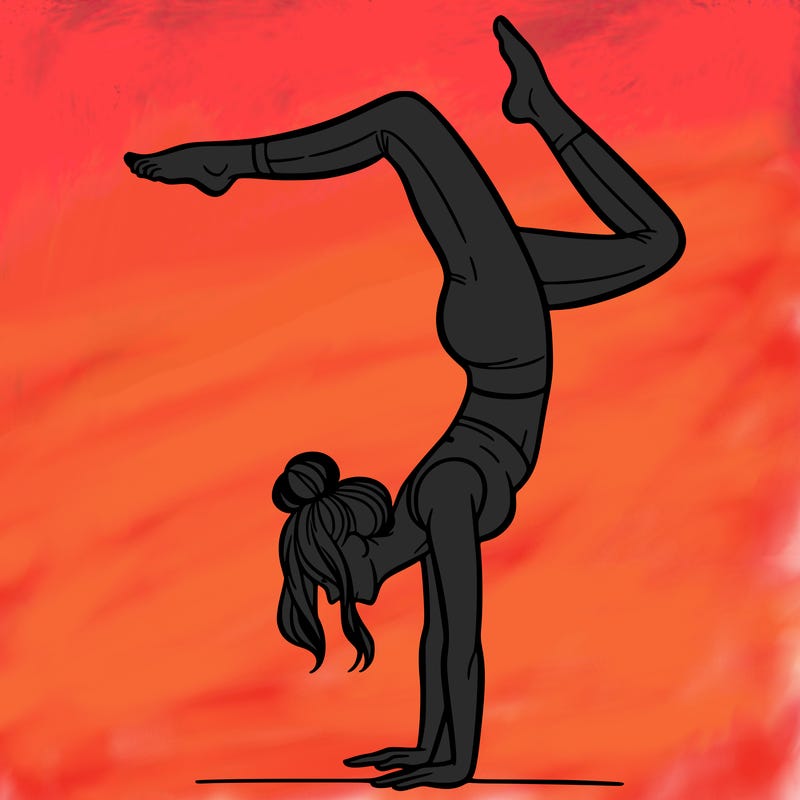a woman doing a handstand