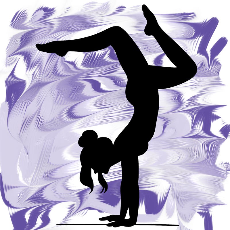 a woman doing a handstand