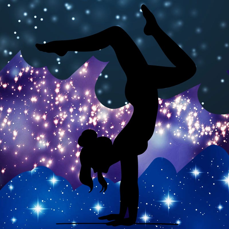 a woman doing a handstand