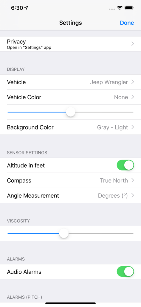 Tiltometer - Settings menu of the Tiltometer app showing vehicle selection for a Jeep Wrangler and various sensor configuration options
